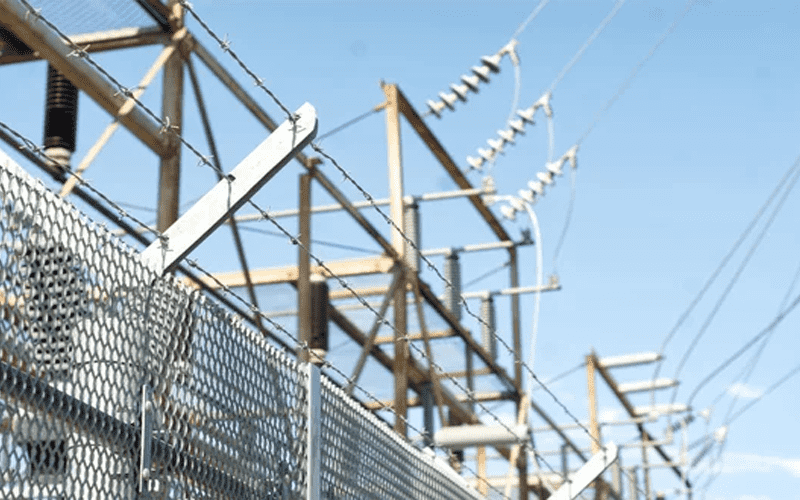 Barbed wire fencing protects buildings
